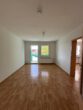 Zwei-Raum-Wohnung mit Balkon im Puschkinweg - Wohnzimmer